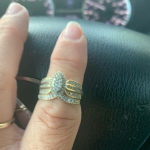 Women’s gold bridal set and silver engagement ring, size is 7.5.